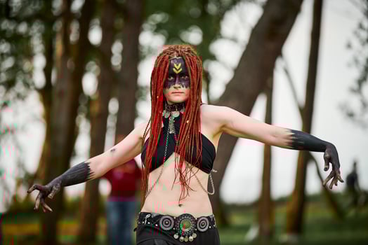 Mythological dancing girl faun on green lawn in public park outdoor art dancing event photo