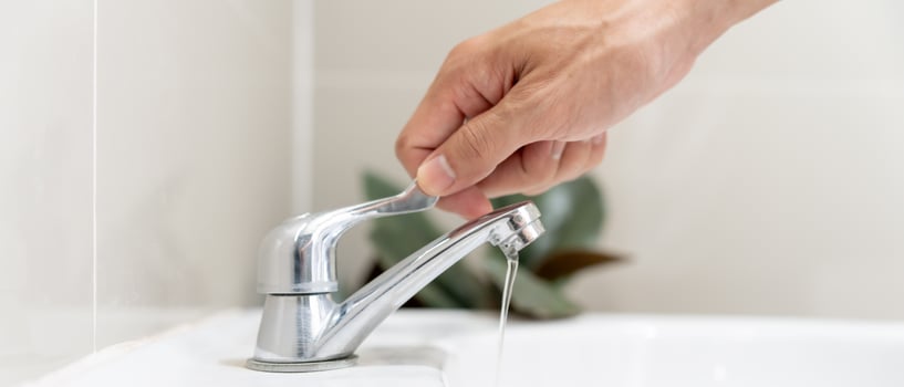 Save water. Man keeps turning off the running water in the bathroom to protect environment. Greening planet, reduce global warming, Save world, life, future, risk energy, crisis , water day. photo