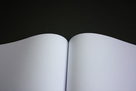 Open page on a black background. Abstract background photo
