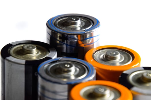 Salt and alkaline batteries, source of energy for portable technology. AAA and AA batteries photo