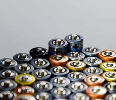 Salt and alkaline batteries, source of energy for portable technology. AAA and AA batteries photo