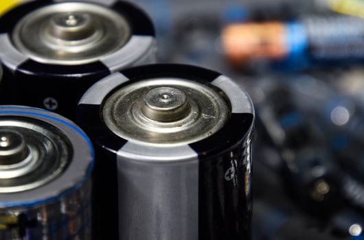 Salt and alkaline batteries, source of energy for portable technology. AAA and AA batteries photo