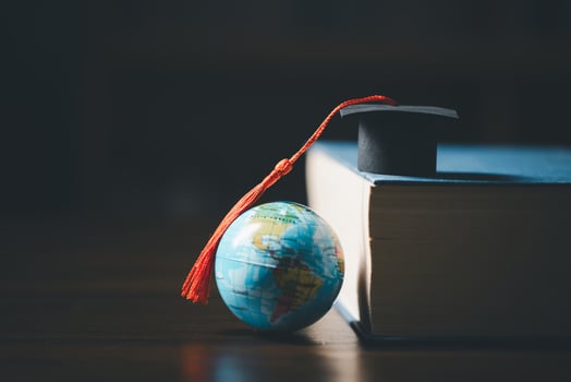 Graduated study abroad international Conceptual, Graduation hat on top Earth globe model map.Congratulations to graduates, Studies lead to success in world wide.Back to School. credited world by NASA photo