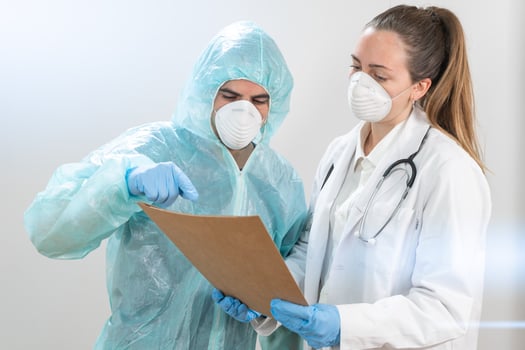 Doctors and nurses working in the hospitals and fighting the coronavirus. Doctors are heroes. Doctors in the protective suits and masks looking for a cure for the disease. photo