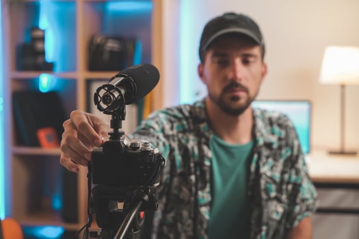 Handsome man with beard shooting a video for social media photo