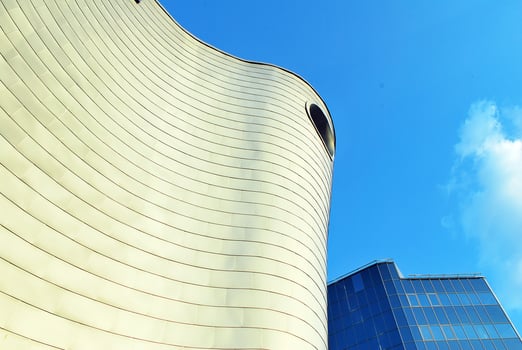 Modern office building in the city with windows and steel and aluminum panels wall. photo