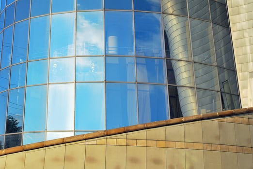 Modern office building in the city with windows and steel and aluminum panels wall. photo