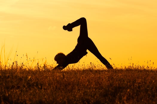 Silhouette of woman doing yoga photo