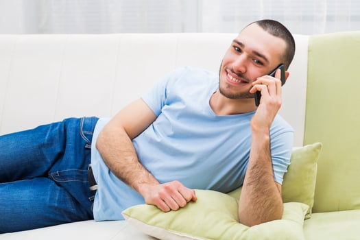 Young man using mobile phone photo