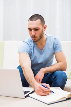 Young businessman working at home photo