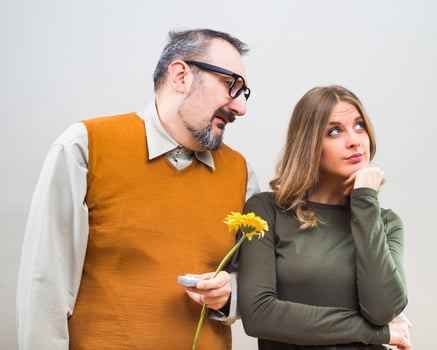 Nerdy man wants to marry to a beautiful woman,but she is not interested. photo