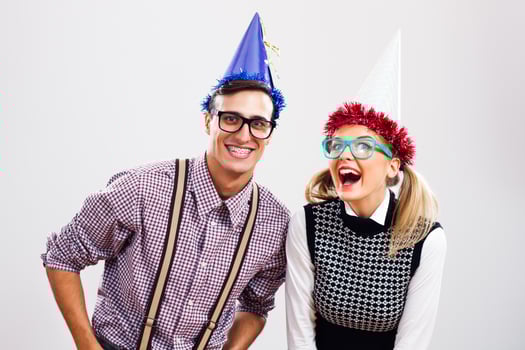 Nerdy man and woman having party photo