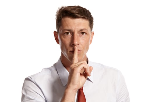 Portrait of a young brunet man posing in a studio isolated over a white background. photo