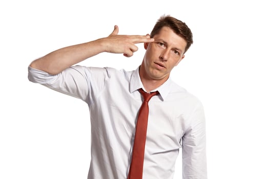 Young man in a classic white shirt and red tie posing isolated on white background. photo
