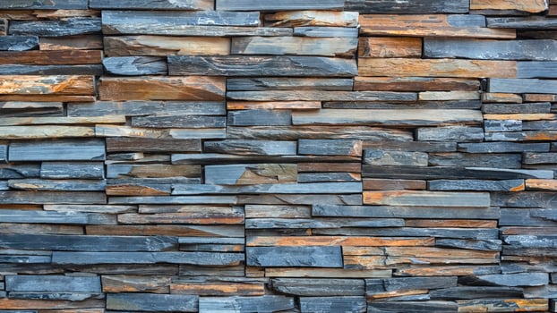 Background and texture of multicolor cladding stone slate wall in loft style photo