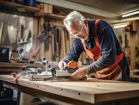 AI generated Senior male carpenter assists younger colleague with measuring and cutting wood in carpentry workshop. Experienced carpenter shares knowledge and expertise with apprentice. photo