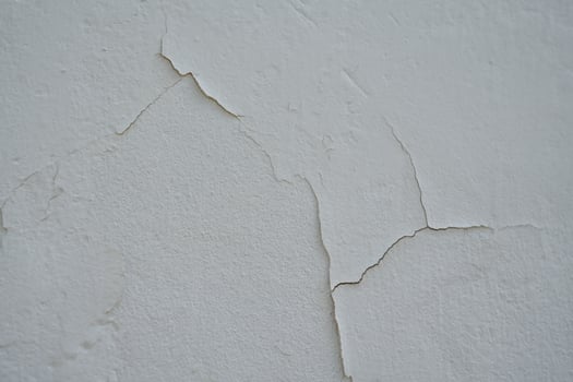 Old cement Wall Peel exterior Background with blue Paint peeling low quality, Cracked Wall photo