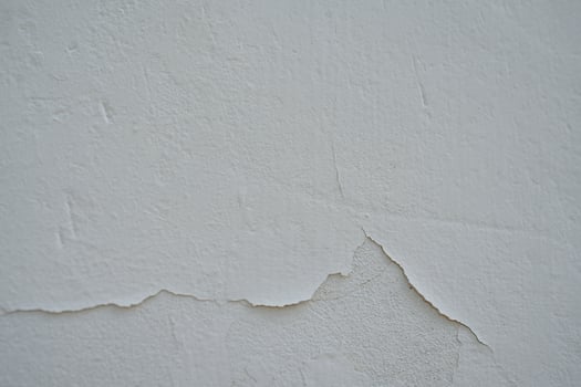 Old cement Wall Peel exterior Background with blue Paint peeling low quality, Cracked Wall photo