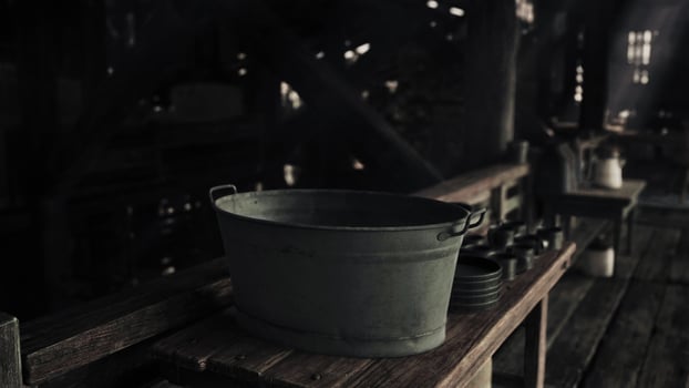 A bucket sitting on a wooden table photo