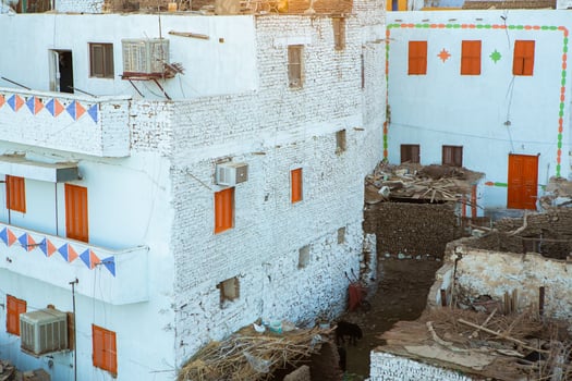 Colourful exterior wall of a Nubian house in Egypt. Typical African village houses facade. Medieval street. photo