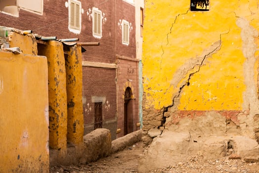 Colourful exterior wall of a Nubian house in Egypt. Typical African village houses facade. Medieval street. photo