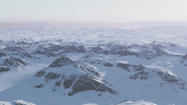 A snow-covered mountain range with majestic peaks in the distance photo