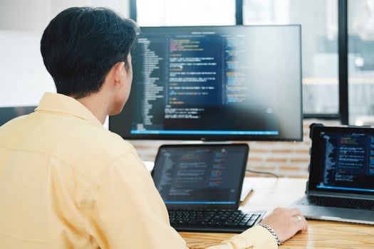 IT Programmer Starts Working on Desktop Computer. photo