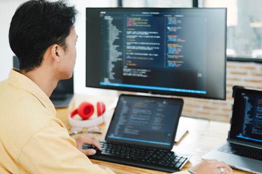 IT Programmer Starts Working on Desktop Computer. photo
