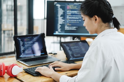 IT Programmer Starts Working on Desktop Computer. photo