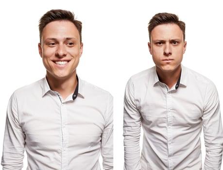 Young man with an expressive face, wearing white shirt, isolated on white background photo