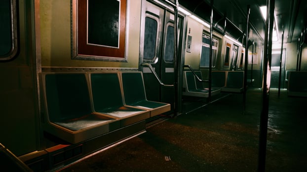 An empty subway car in a dimly lit metro station photo