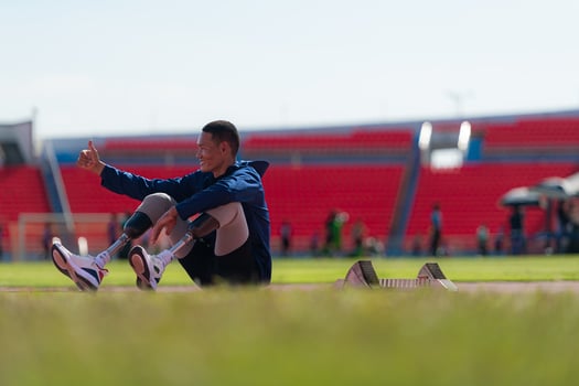 Athletes with disabilities take a break at the stadium between training sessions. photo