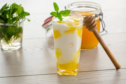 prepared homemade yogurt with natural honey in a glass photo