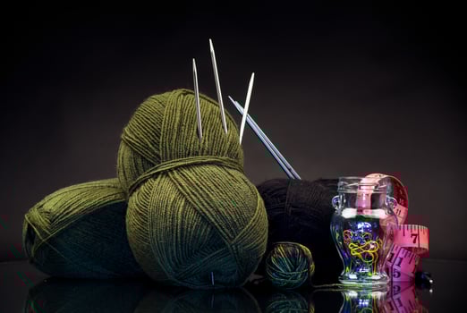 wool yarn, knitting needles and other tools for hand knitting. photo