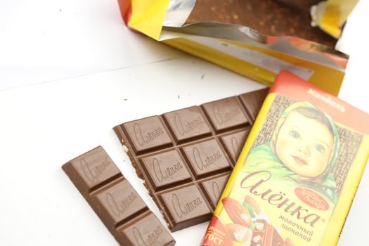 KHARKIV, UKRAINE - JANUARY 27, 2021 Alyonka chocolate square bars - product from Red October chocolate factory photo
