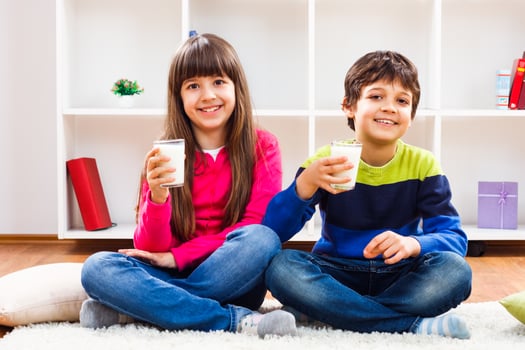 Two children drinking milk photo