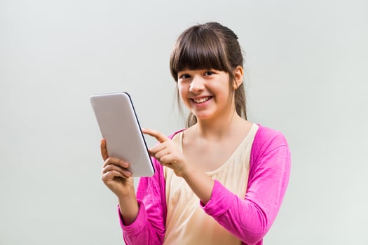 Little girl using digital tablet photo