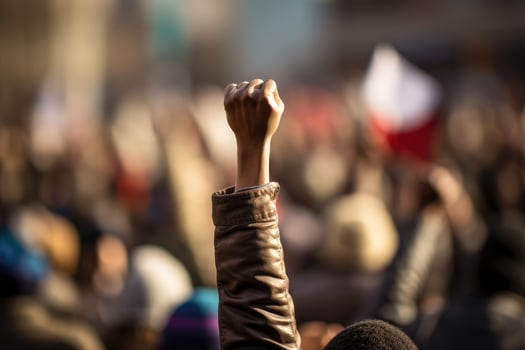AI generated Protest against the government in Paris, France. Demonstrators raised their hands up, A raised fist of a protestor at a political demonstration, AI Generated photo