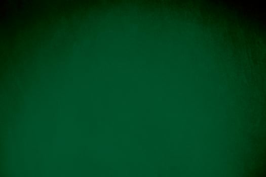Green velvet fabric texture used as background. Emerald color panne fabric background of soft and smooth textile material. crushed velvet .luxury emerald tone for silk.. photo