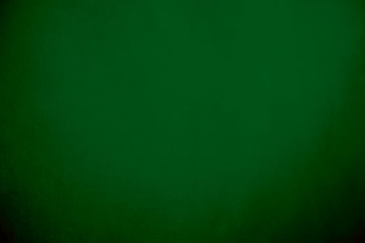 Green velvet fabric texture used as background. Emerald color panne fabric background of soft and smooth textile material. crushed velvet .luxury emerald tone for silk.. photo