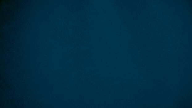 blue velvet  soft rough textile material background texture close up,poker table,tennis ball,table cloth. Empty navy blue fabric denim background. photo