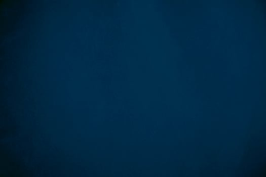 blue velvet  soft rough textile material background texture close up,poker table,tennis ball,table cloth. Empty navy blue fabric denim background. photo