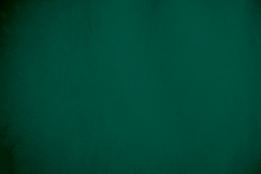 Green velvet fabric texture used as background. Emerald color panne fabric background of soft and smooth textile material. crushed velvet .luxury emerald tone for silk.. photo