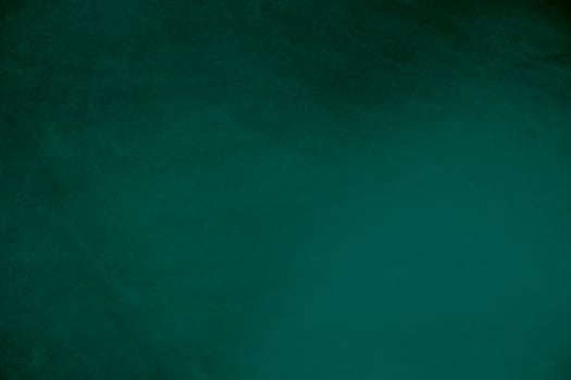 Green velvet fabric texture used as background. Emerald color panne fabric background of soft and smooth textile material. crushed velvet .luxury emerald tone for silk.. photo