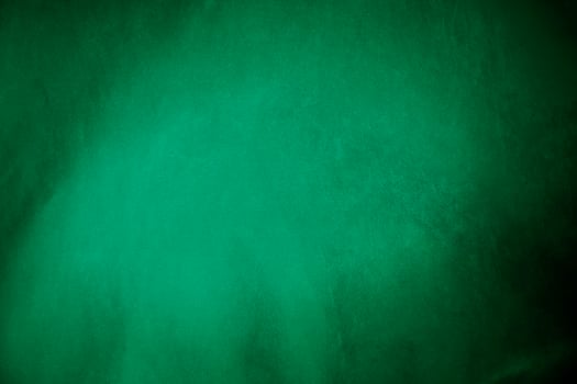 Green velvet fabric texture used as background. Emerald color panne fabric background of soft and smooth textile material. crushed velvet .luxury emerald tone for silk.. photo