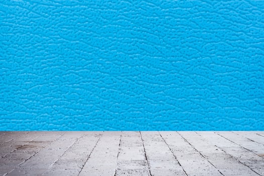 Blue leather wall background with wooden floor photo