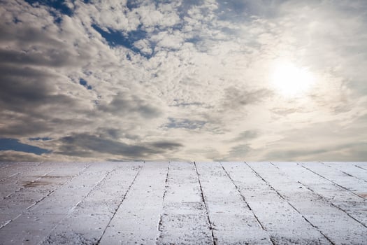 An empty concrete floor with a sky background photo