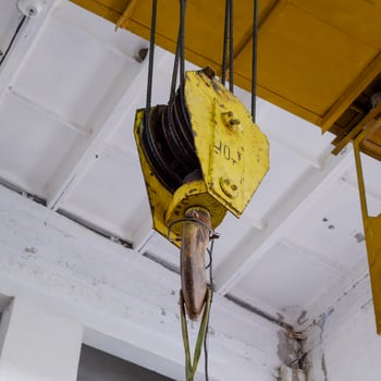 Hoist with winch and hook. A tool for moving goods in a producti photo