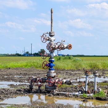 Oil well after repair in mud and puddles. photo