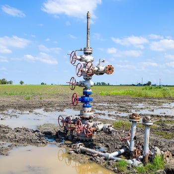 Oil well after repair in mud and puddles. photo